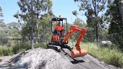 how steep of a hill can a mini excavator climb|climbing a slope with mini excavator.